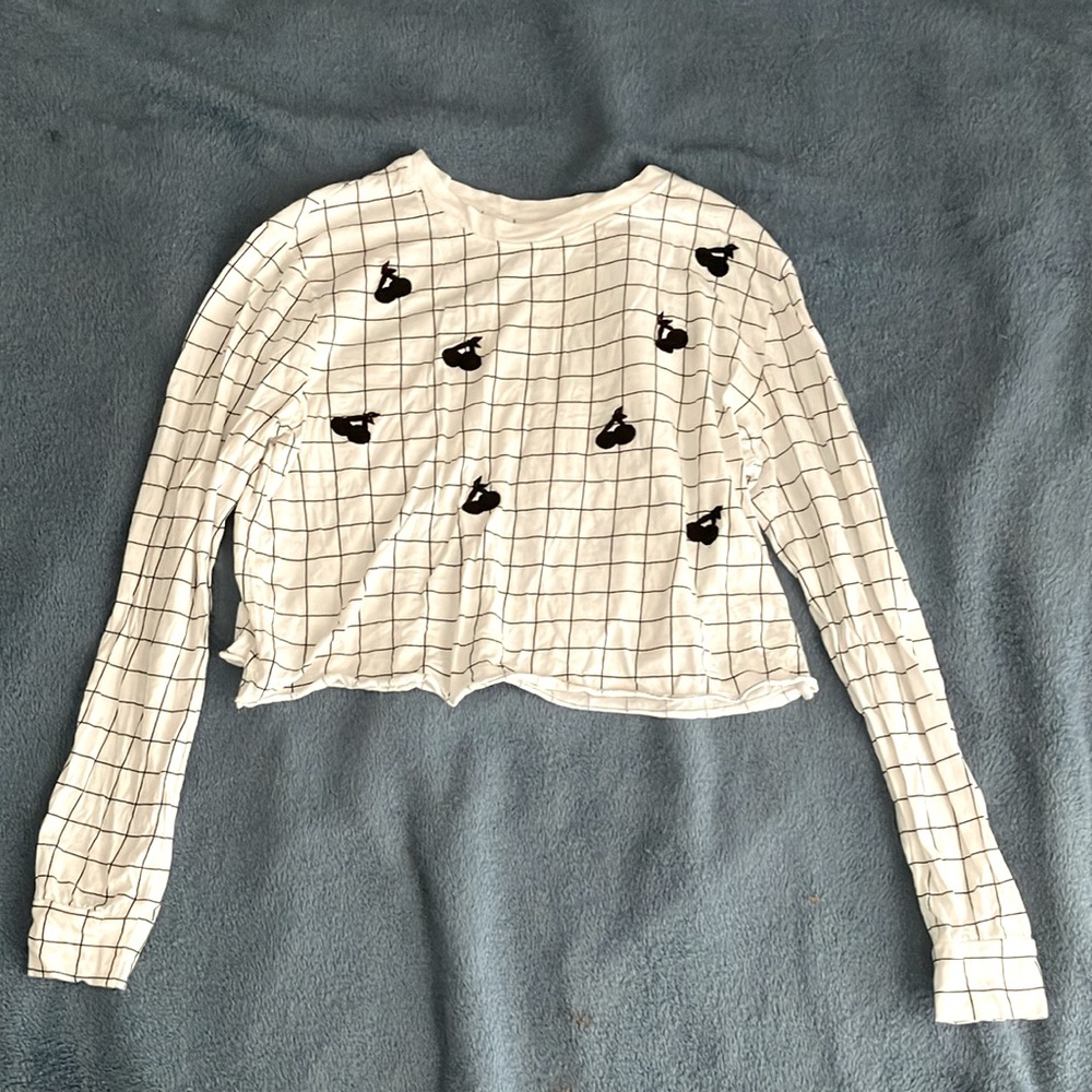 Cute white crop top, with cherry design on the front.